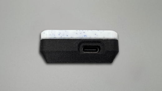 Charging port opening in the top shell